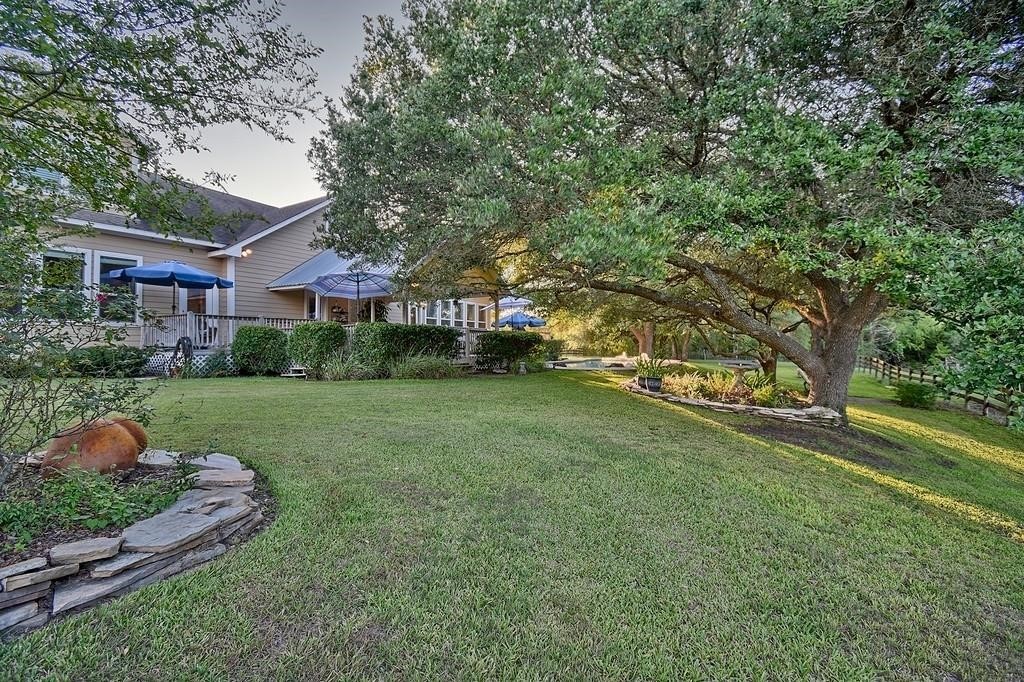 8456 Schuster Road Ledbetter, TX 78946 - Photo 25 of 49 a view of a house with a backyard