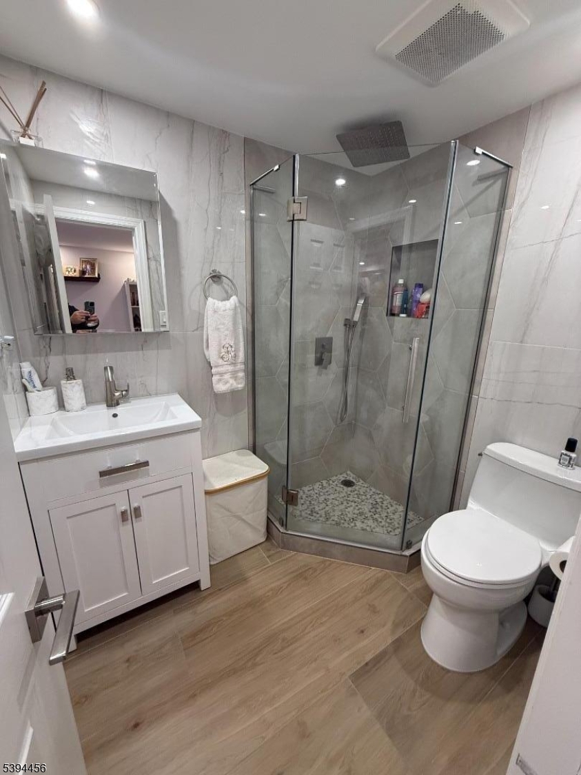 18 Aubrey Street Summit, NJ 07901 - Photo 14 of 20 a bathroom with a sink a toilet and shower