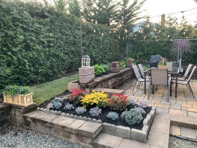 a view of a tables and chairs and potted on the water
