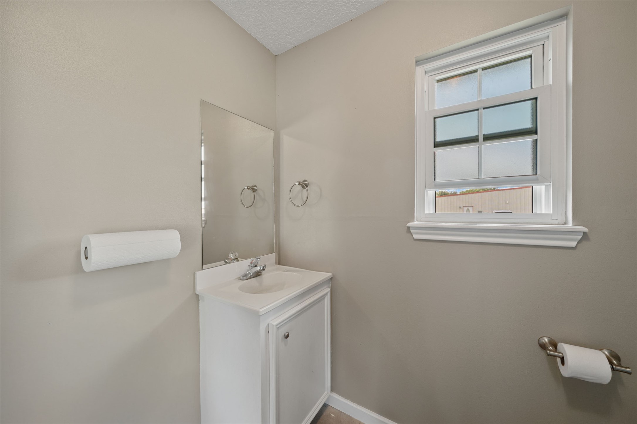 18823 Cypress Church Road Cypress, TX 77433 - Photo 26 of 44 a bathroom with a sink a toilet and window
