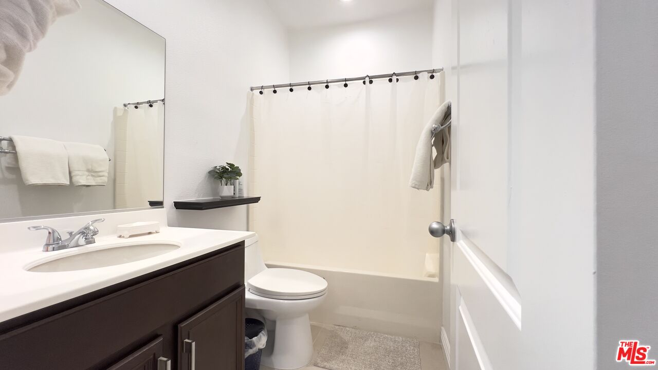 84330 Tramonto Way Indio, CA 92203 - Photo 12 of 18 a bathroom with a sink a toilet and shower