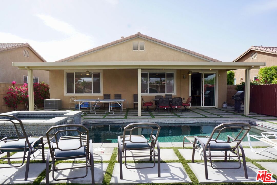 84330 Tramonto Way Indio, CA 92203 - Photo 14 of 18 a view of a dining table and chairs in the patio