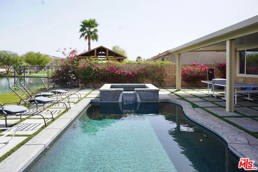 84330 Tramonto Way Indio, CA 92203 - Photo 15 of 18 a view of a balcony with two chairs and a table
