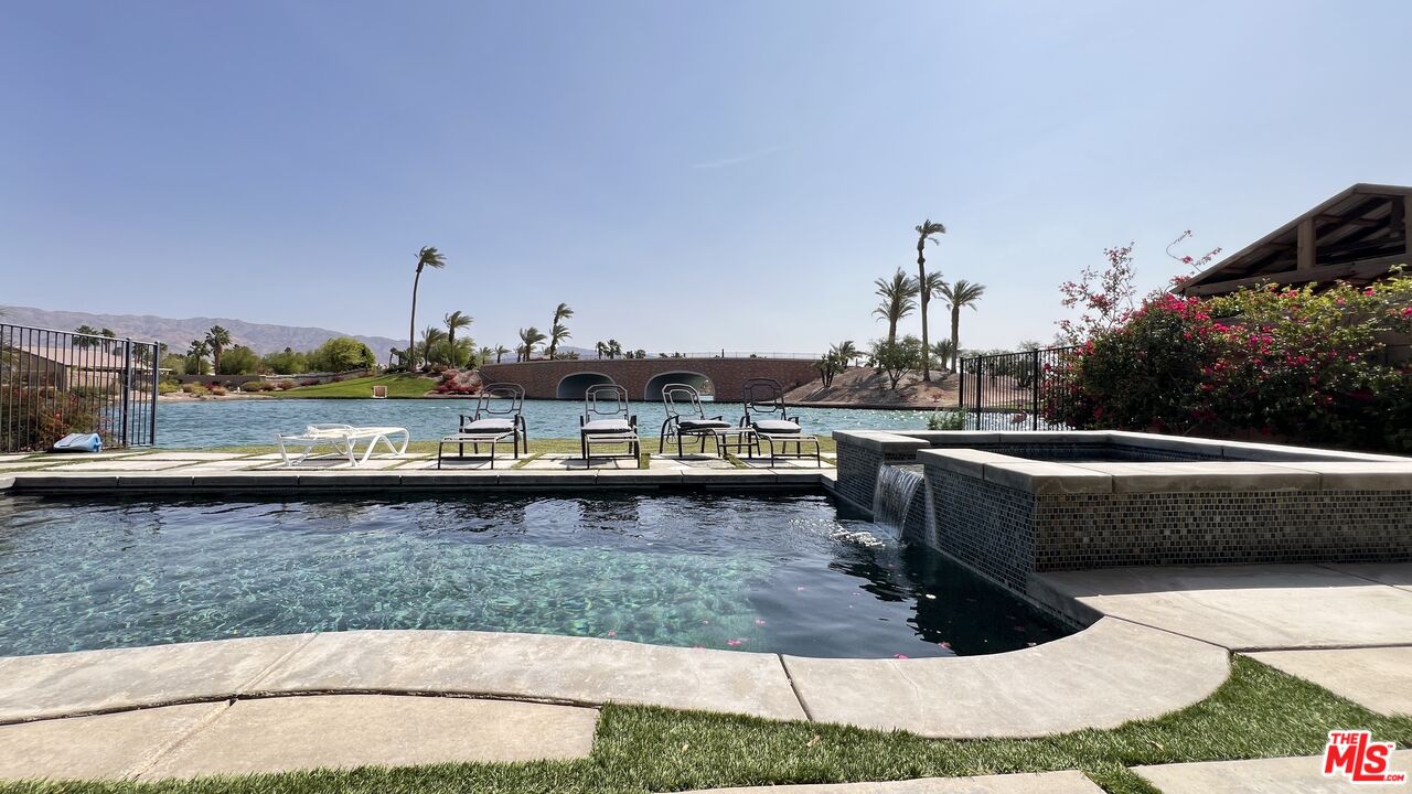 84330 Tramonto Way Indio, CA 92203 - Photo 17 of 18 a view of a swimming pool with a lounge chair