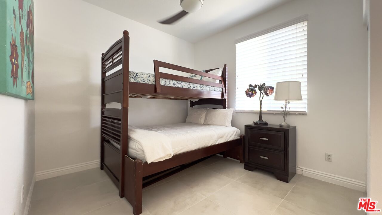 84330 Tramonto Way Indio, CA 92203 - Photo 7 of 18 a bedroom with a bed and window