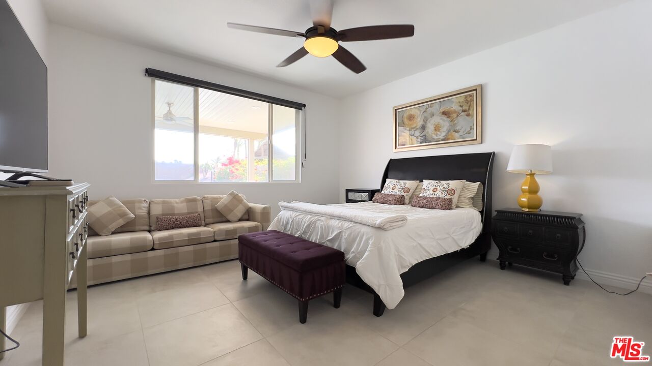 84330 Tramonto Way Indio, CA 92203 - Photo 8 of 18 a bedroom with a bed couches and window