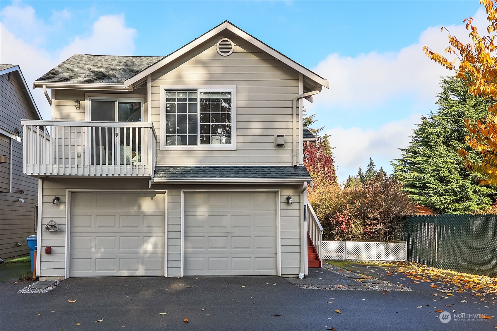 8317 233rd Street Southwest, Unit 3 Edmonds, WA 98026 - Photo 31 of 31 a front view of a house with a garage