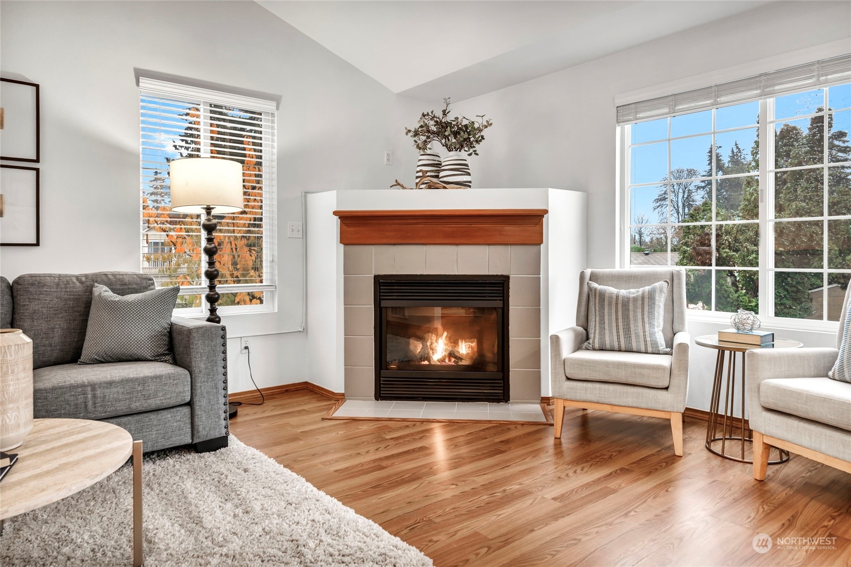 8317 233rd Street Southwest, Unit 3 Edmonds, WA 98026 - Photo 4 of 31 a living room with furniture and a fireplace