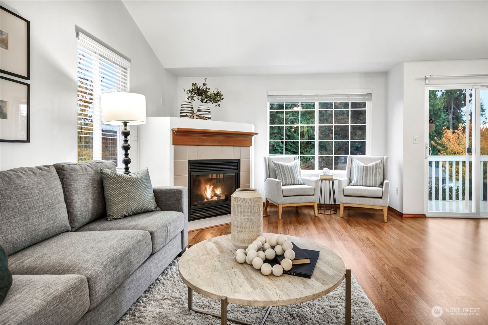 8317 233rd Street Southwest, Unit 3 Edmonds, WA 98026 - Photo 5 of 31 a living room with furniture and a fireplace