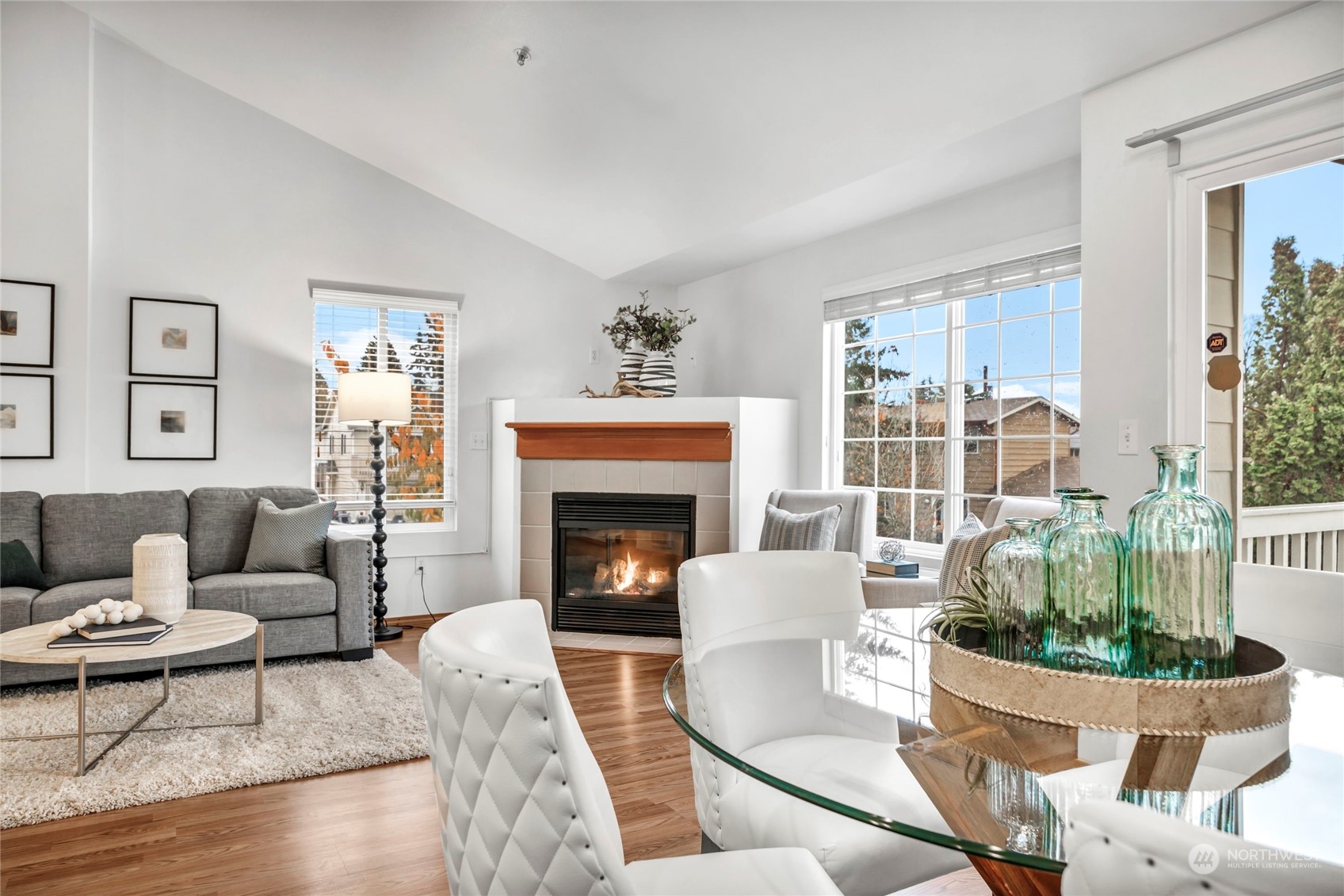 8317 233rd Street Southwest, Unit 3 Edmonds, WA 98026 - Photo 7 of 31 a living room with furniture a fireplace and a potted plant