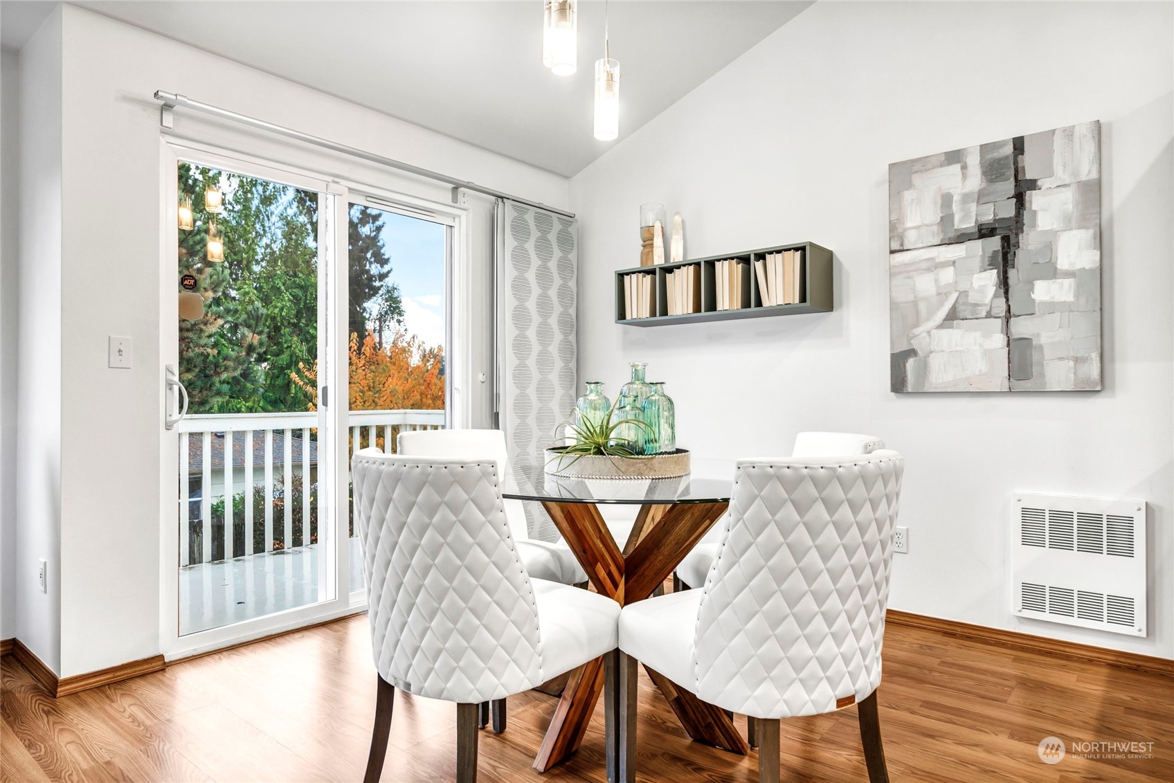 8317 233rd Street Southwest, Unit 3 Edmonds, WA 98026 - Photo 8 of 31 a view of a dining room with furniture window and wooden floor