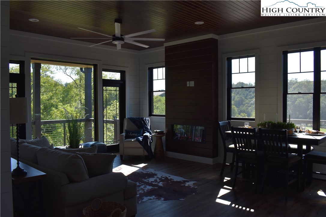 1518 Moxley Ridge Road Independence, VA 24348 - Photo 14 of 50 a living room with furniture and floor to ceiling windows