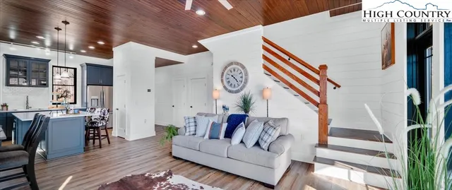 a bedroom with a bed and a night stand