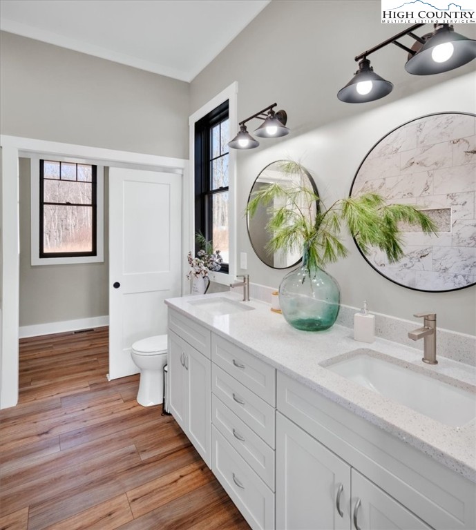 1518 Moxley Ridge Road Independence, VA 24348 - Photo 25 of 50 a bathroom with a double vanity sink and mirror