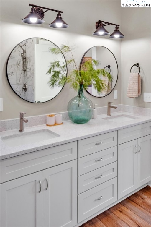 1518 Moxley Ridge Road Independence, VA 24348 - Photo 27 of 50 a bathroom with a granite countertop toilet a sink and mirror