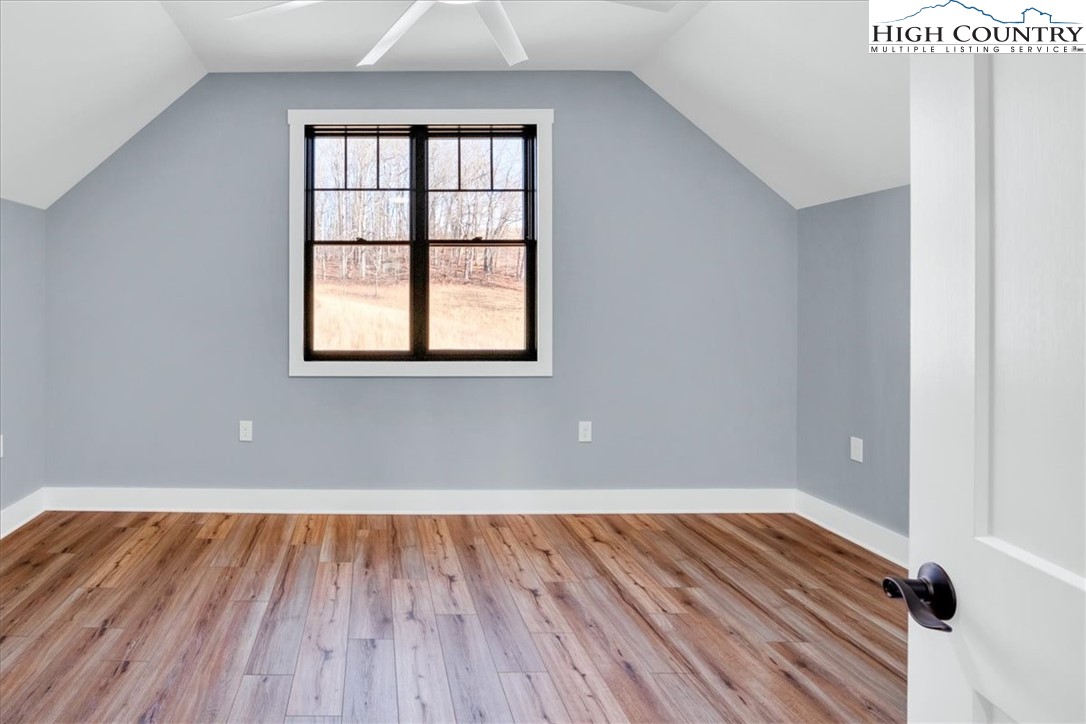 1518 Moxley Ridge Road Independence, VA 24348 - Photo 31 of 50 an empty room with wooden floor and windows
