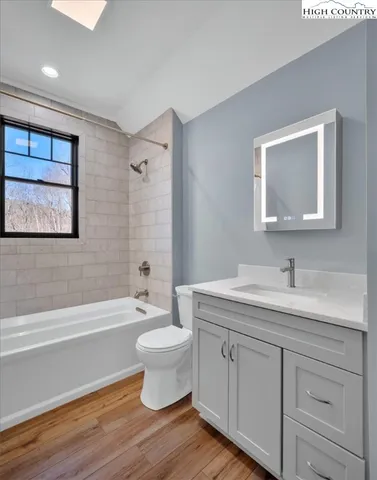 a view of a chairs and table on the wooden deck