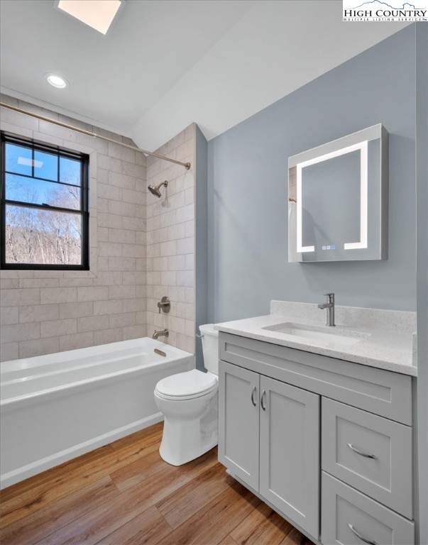 1518 Moxley Ridge Road Independence, VA 24348 - Photo 34 of 50 a bathroom with a toilet a sink a mirror a bathtub and vanity