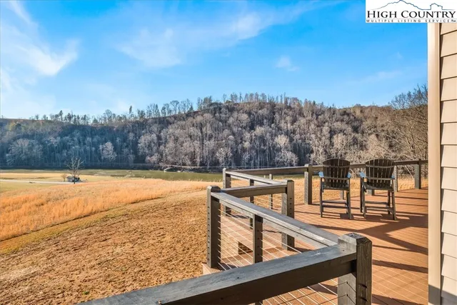 a view of a house with a yard and covered with snow