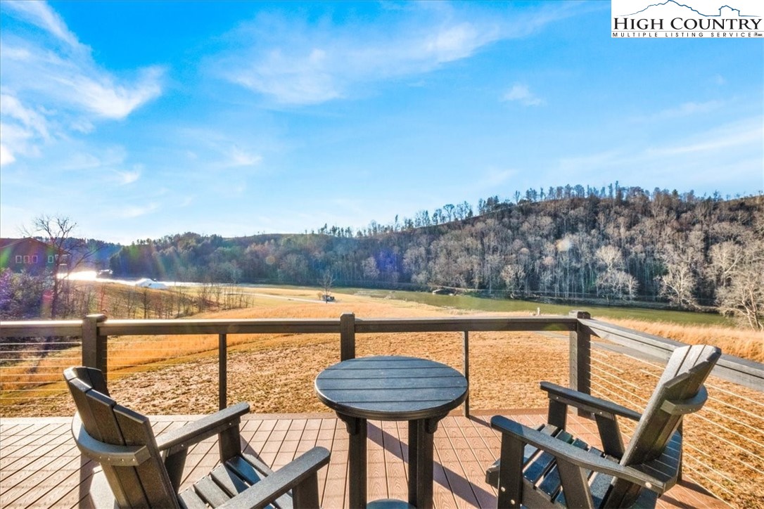 1518 Moxley Ridge Road Independence, VA 24348 - Photo 38 of 50 a view of a lake with couches and wooden floor