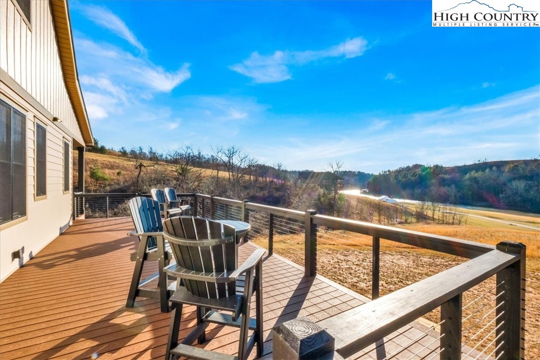1518 Moxley Ridge Road Independence, VA 24348 - Photo 39 of 50 a view of a chairs and table on the wooden deck