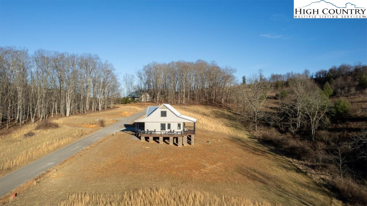 1518 Moxley Ridge Road Independence, VA 24348 - Photo 42 of 50 a view of a house with a yard and covered with snow