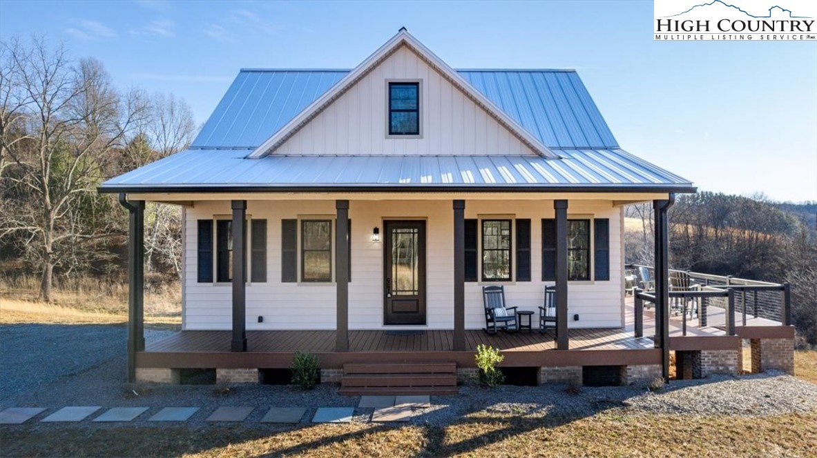1518 Moxley Ridge Road Independence, VA 24348 - Photo 50 of 50 a front view of a house with a yard outdoor seating and mountain view