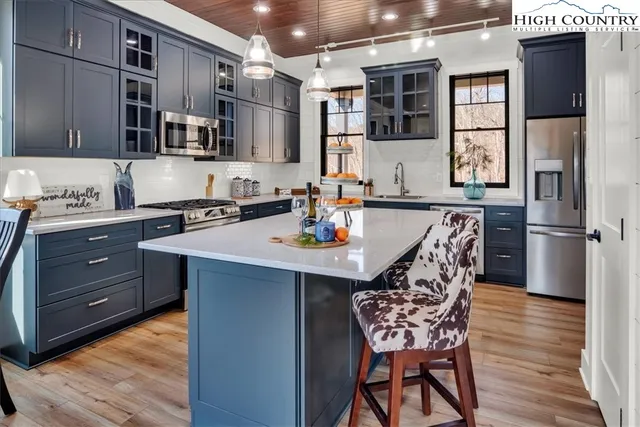 a dining room with furniture window and wooden floor