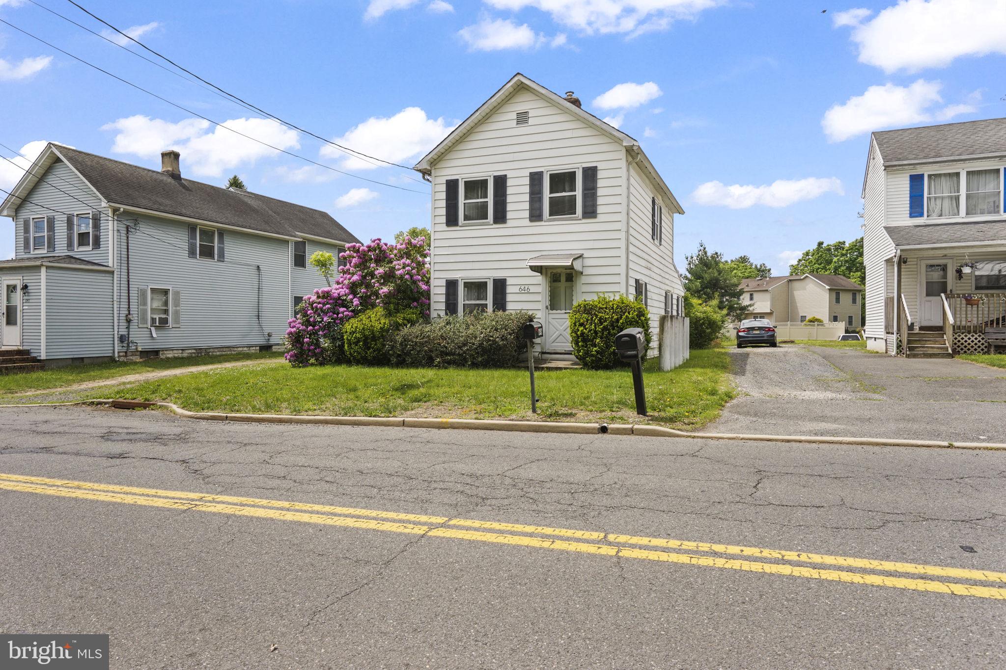 646 Ridge Road Monmouth Junction, NJ 08852 - Photo 1 of 47 Charming home with vibrant landscaping.