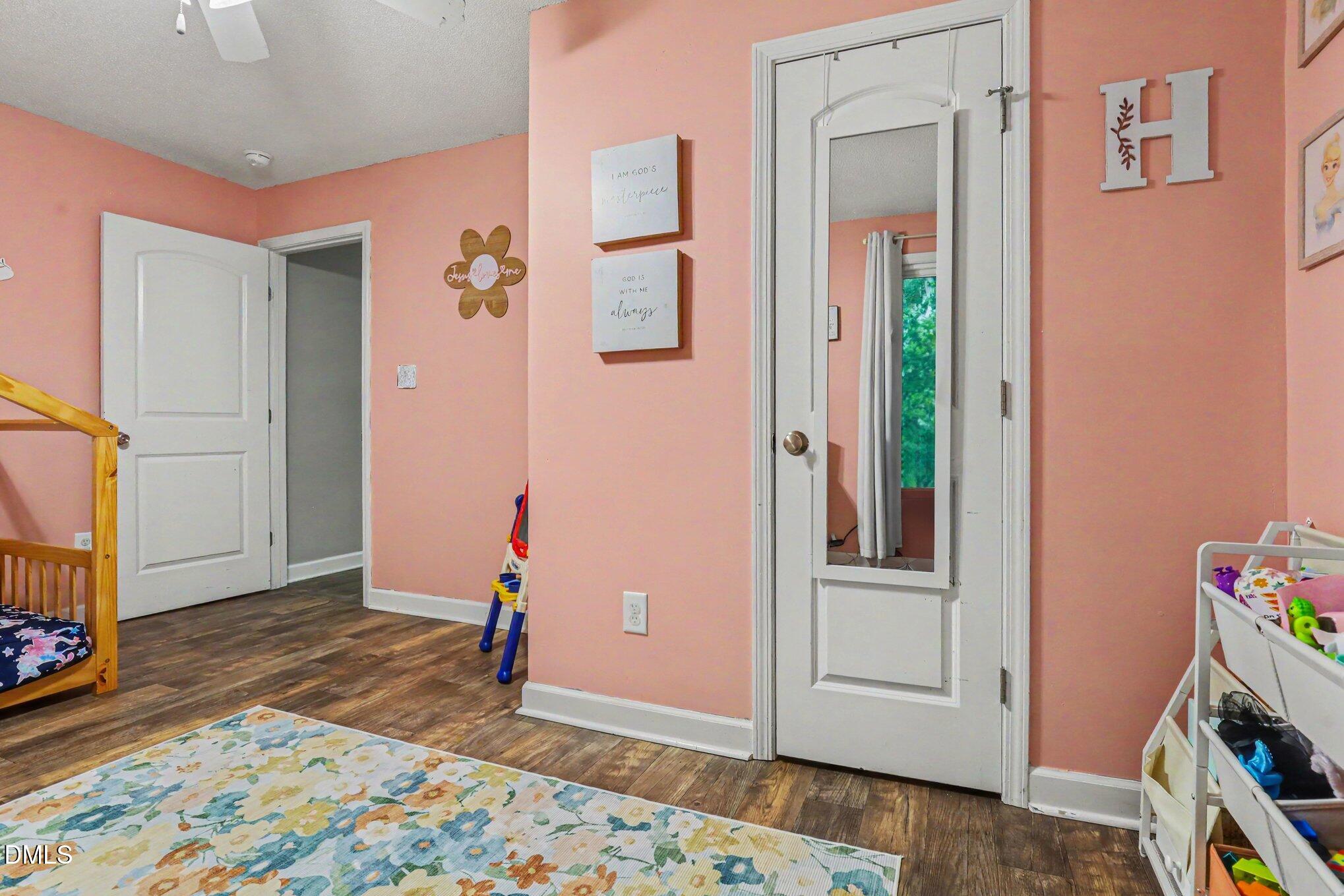 977 Stevens Mill Road Goldsboro, NC 27530 - Photo 24 of 31 a view of a hallway with wooden floor and closet