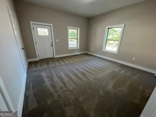 an empty room with windows