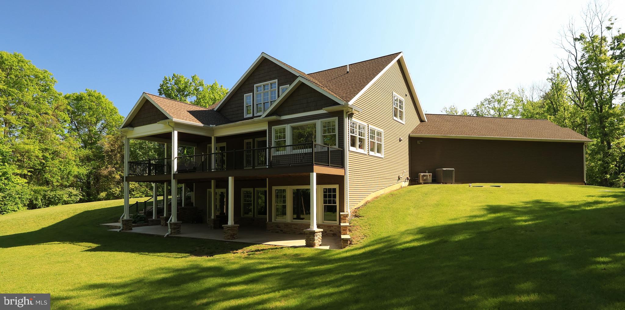 518 Two Mile Road Howard, PA 16841 - Photo 62 of 84 a front view of a house with a yard table and chairs