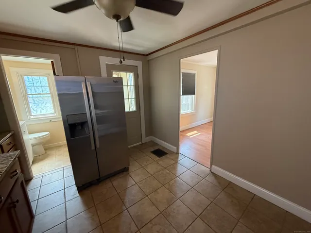 a bathroom with a sink a toilet and bathtub