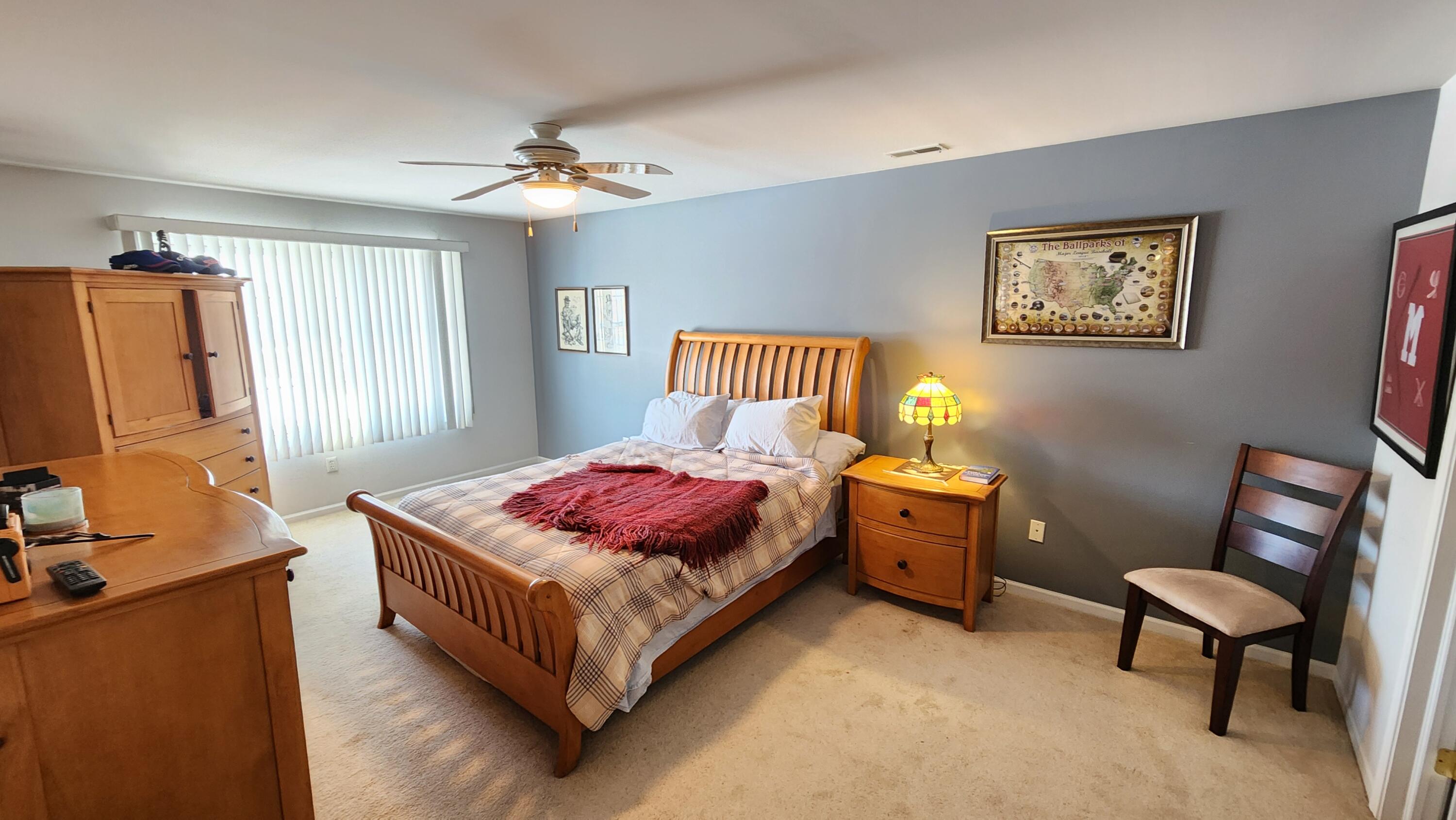 604 Cambridge Court, Unit 2A Munster, IN 46321 - Photo 14 of 31 a bedroom with a bed and wooden floor