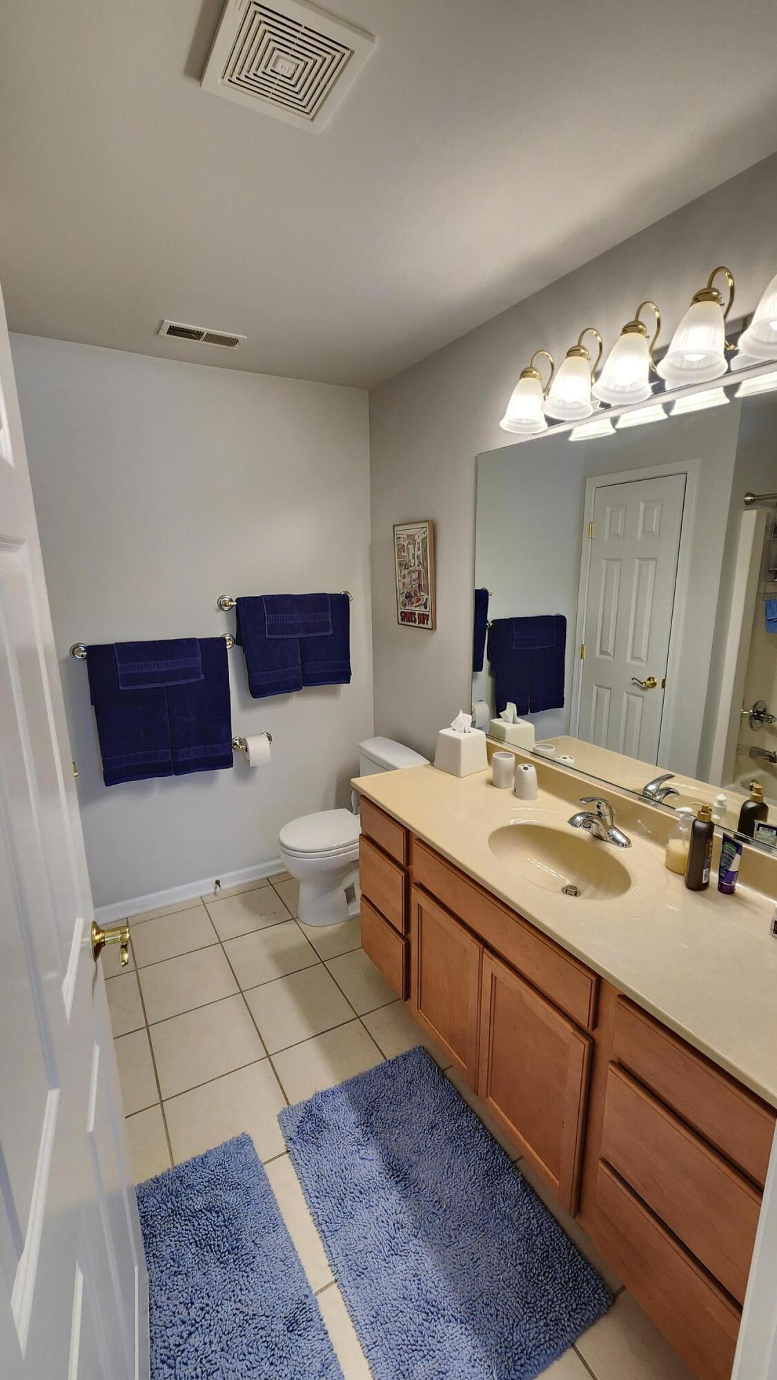 604 Cambridge Court, Unit 2A Munster, IN 46321 - Photo 17 of 31 a bathroom with a sink and a mirror