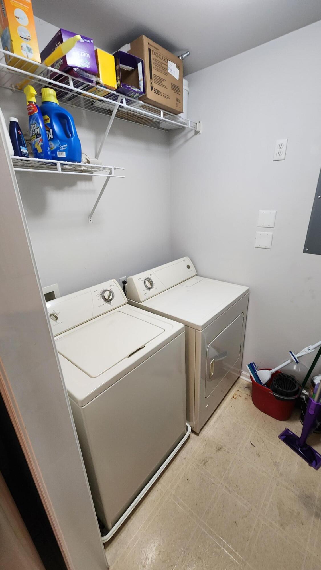604 Cambridge Court, Unit 2A Munster, IN 46321 - Photo 25 of 31 a utility room with dryer washer and a fridge