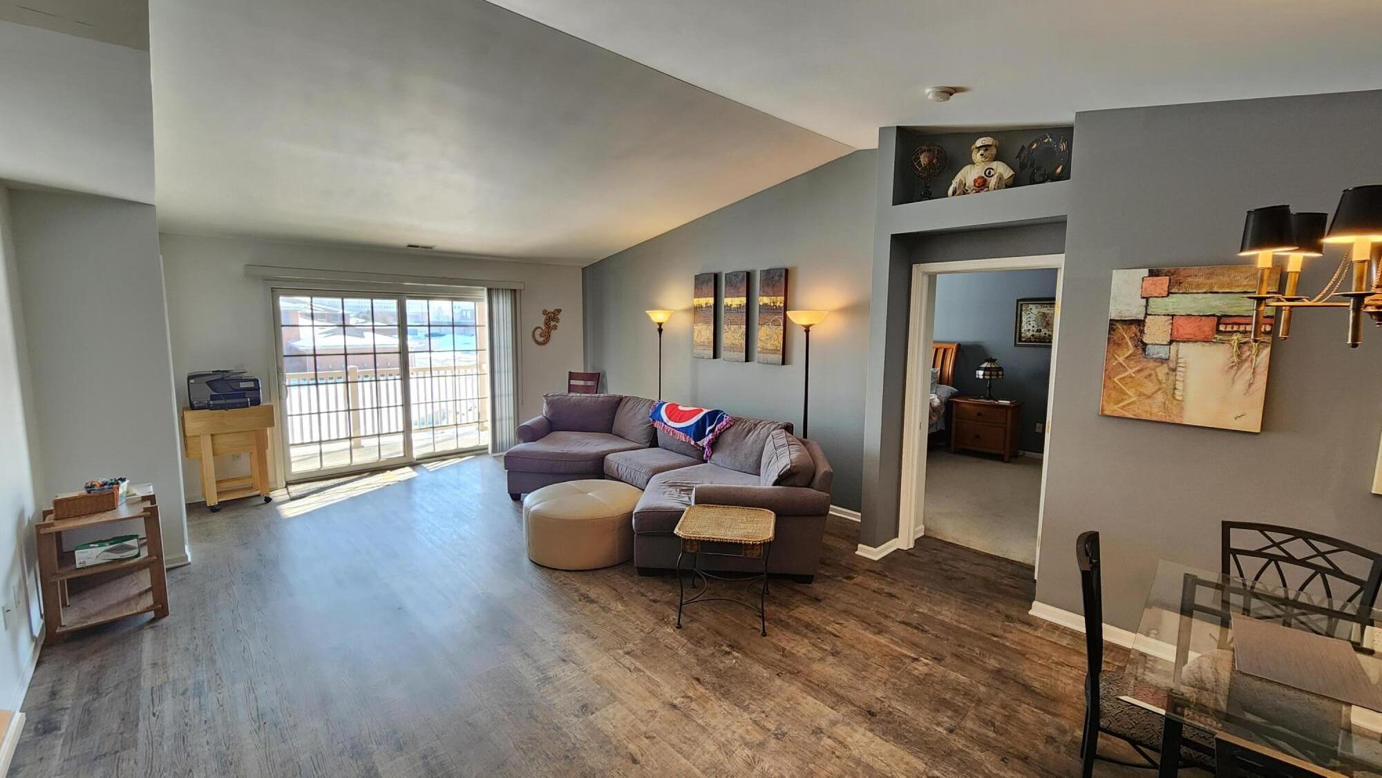 604 Cambridge Court, Unit 2A Munster, IN 46321 - Photo 4 of 31 a living room with furniture and a wooden floor