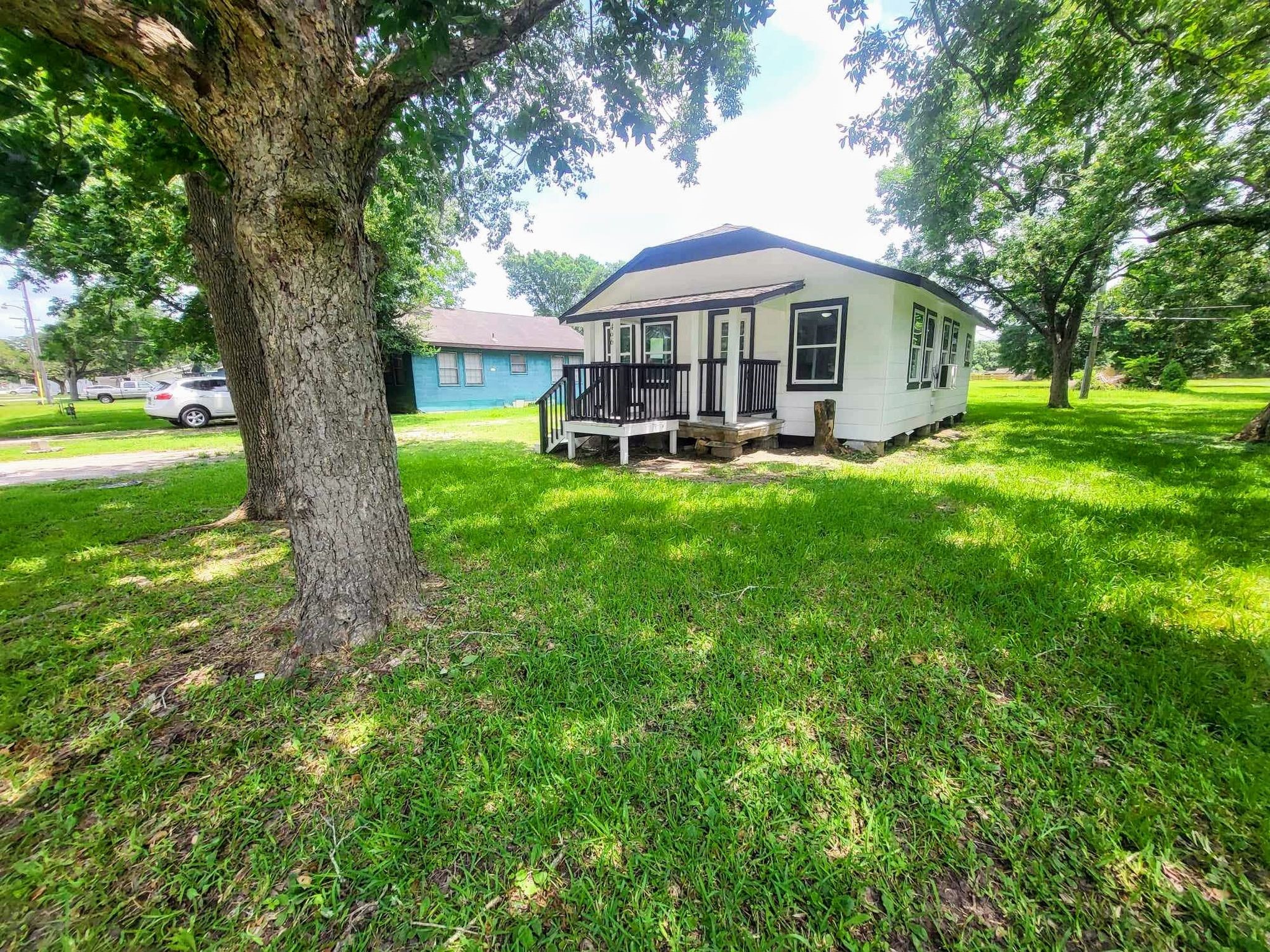 406 East Foley Street Alvin, TX 77511 - Photo 3 of 23 Beautiful shade tree in the front yard