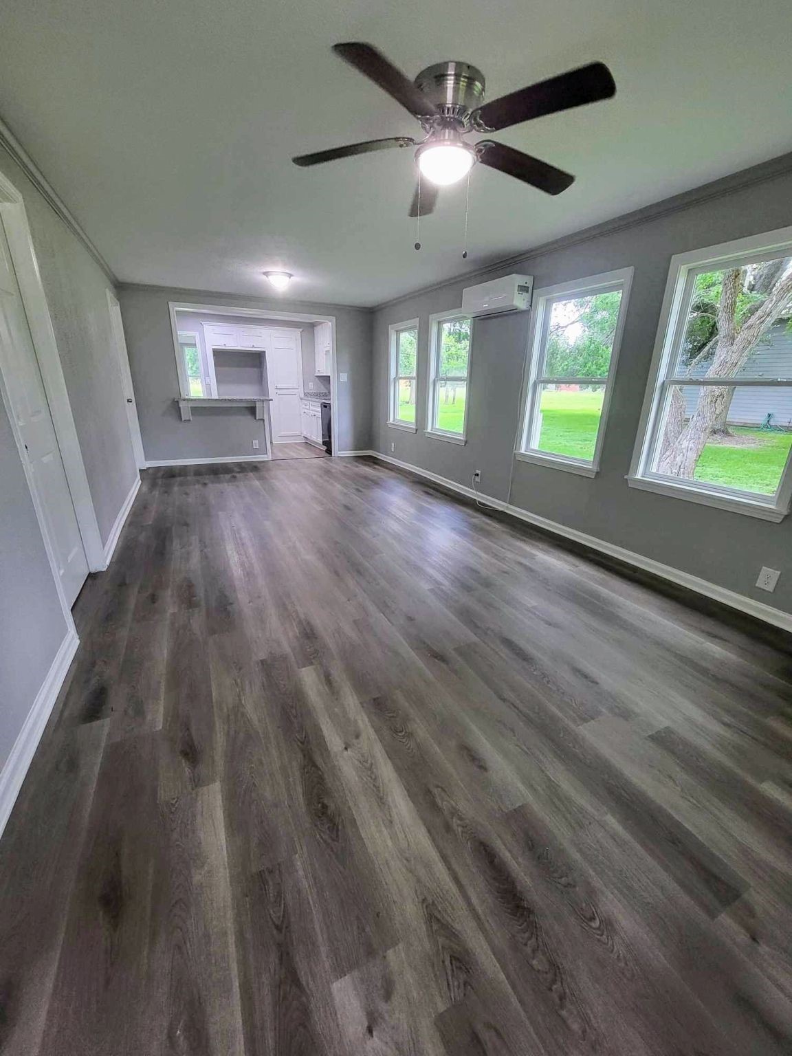 406 East Foley Street Alvin, TX 77511 - Photo 5 of 23 Step into the living room with plenty of natural light