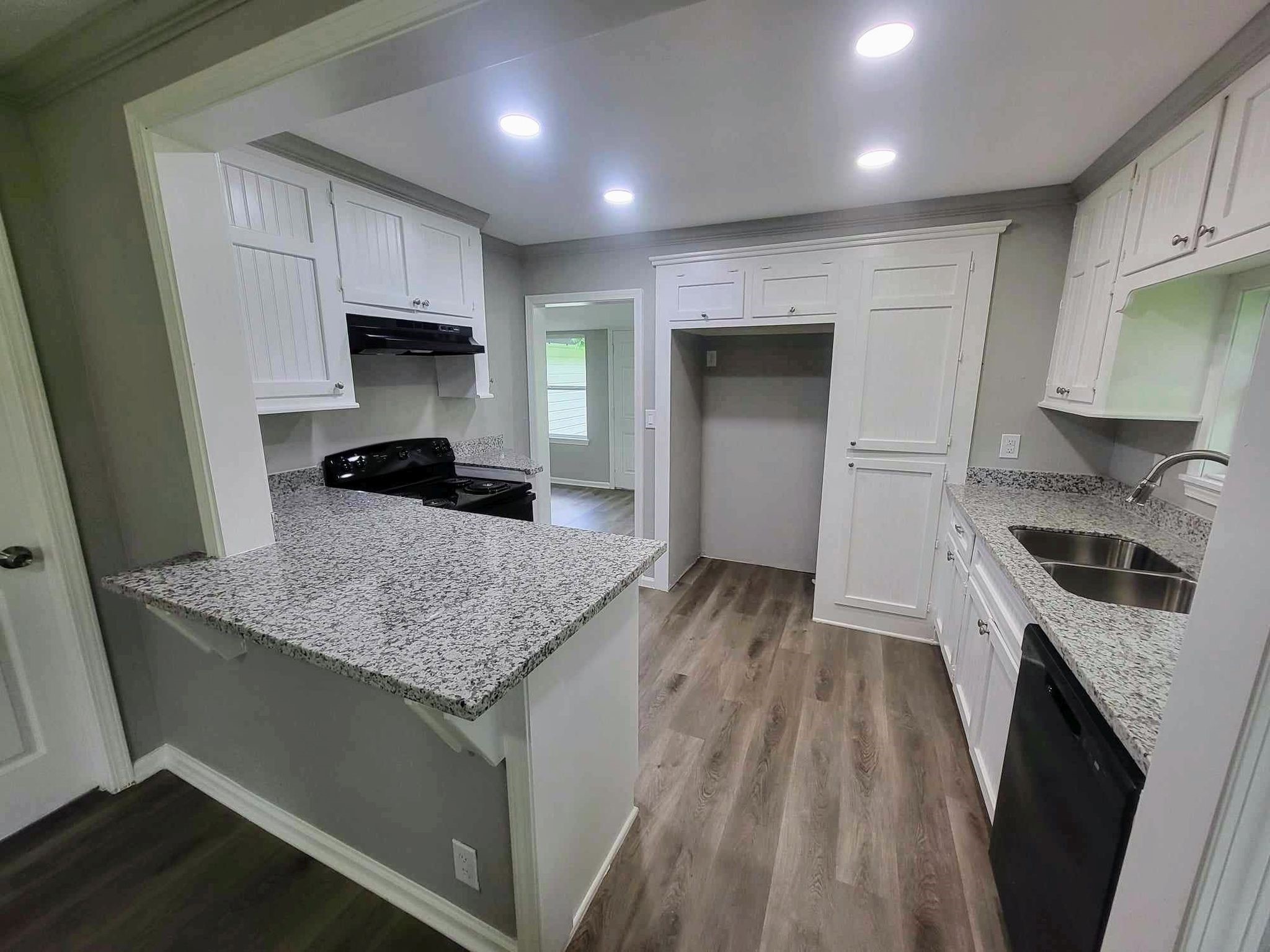 406 East Foley Street Alvin, TX 77511 - Photo 7 of 23 Fully updated kitchen with custom cabinets, granite countertops, recessed lighting, new appliances & more!