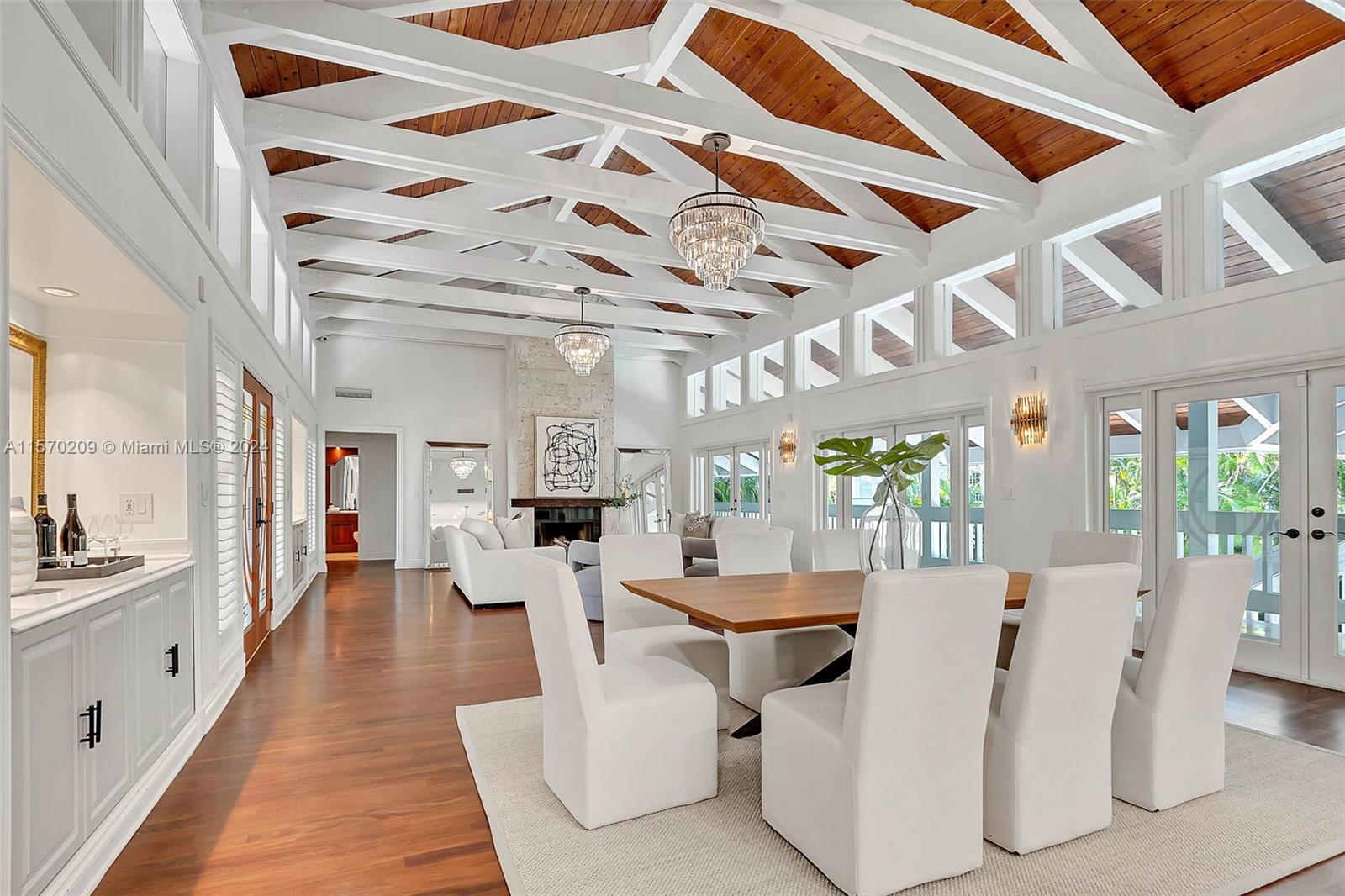 a living room with lots of furniture and white walls