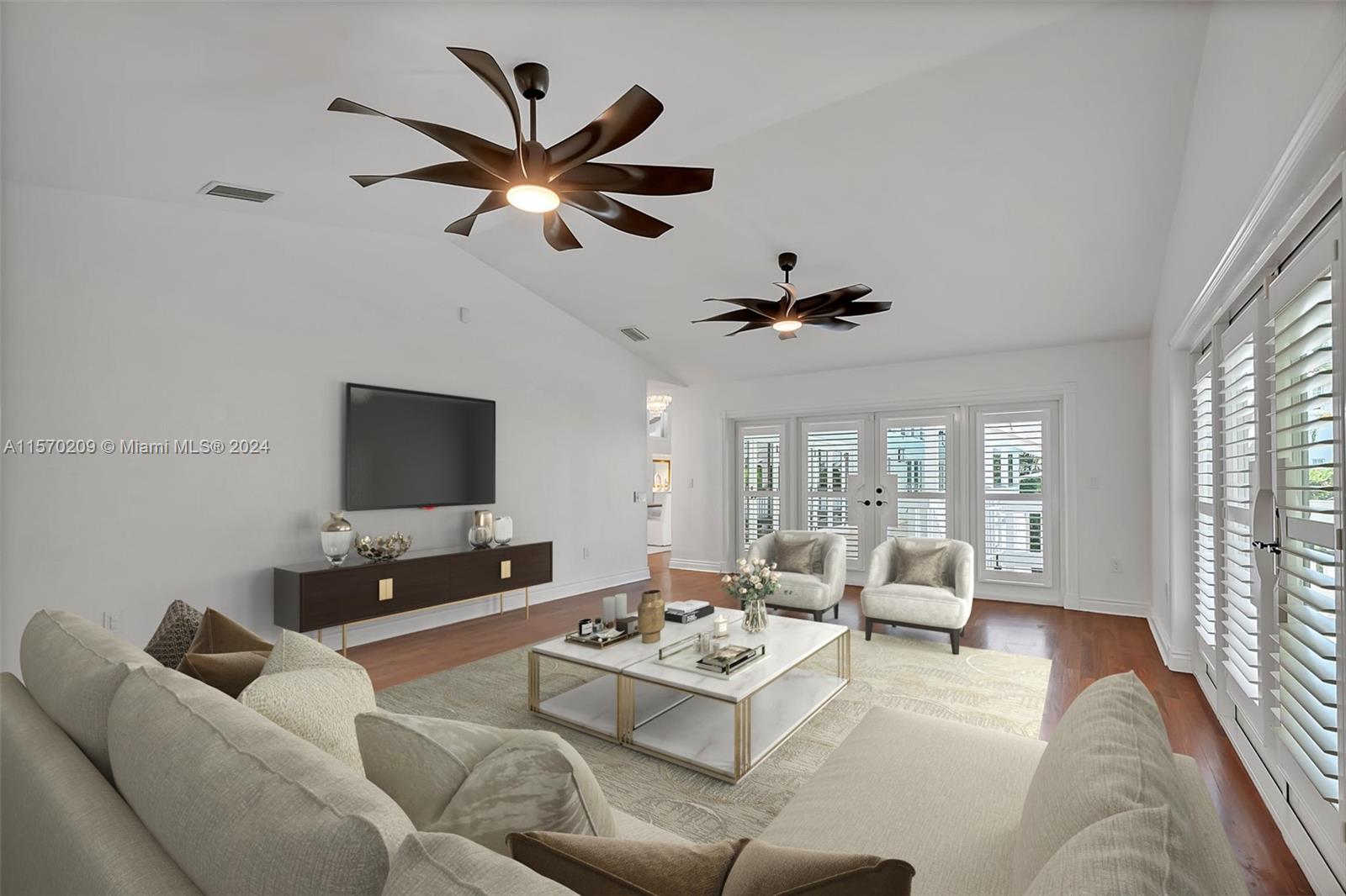 3620 Curtis Lane Miami, FL 33133 - Photo 12 of 33 a living room with furniture or couch and a flat screen tv