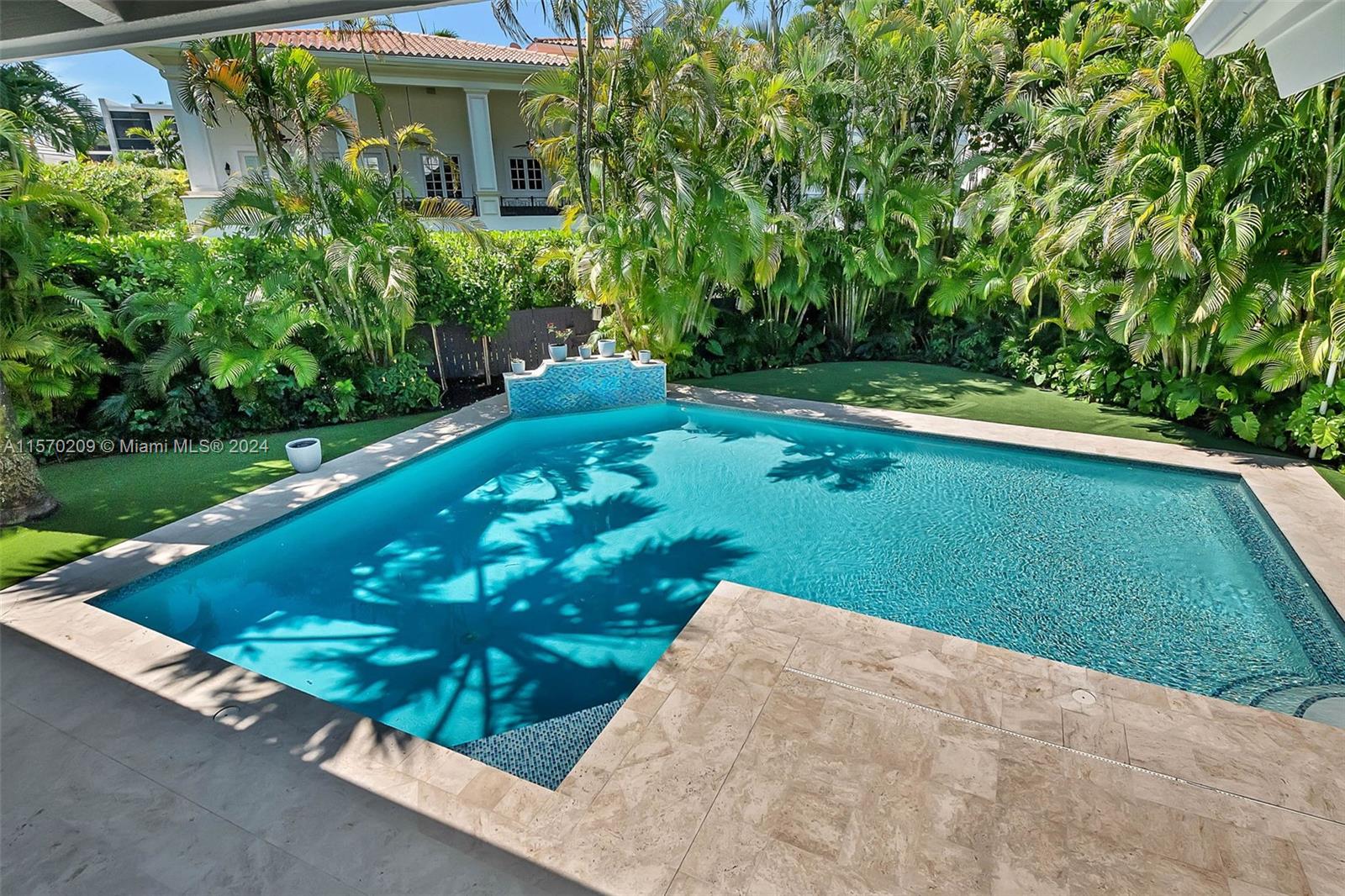 3620 Curtis Lane Miami, FL 33133 - Photo 19 of 33 a view of a garden with a bench in garden