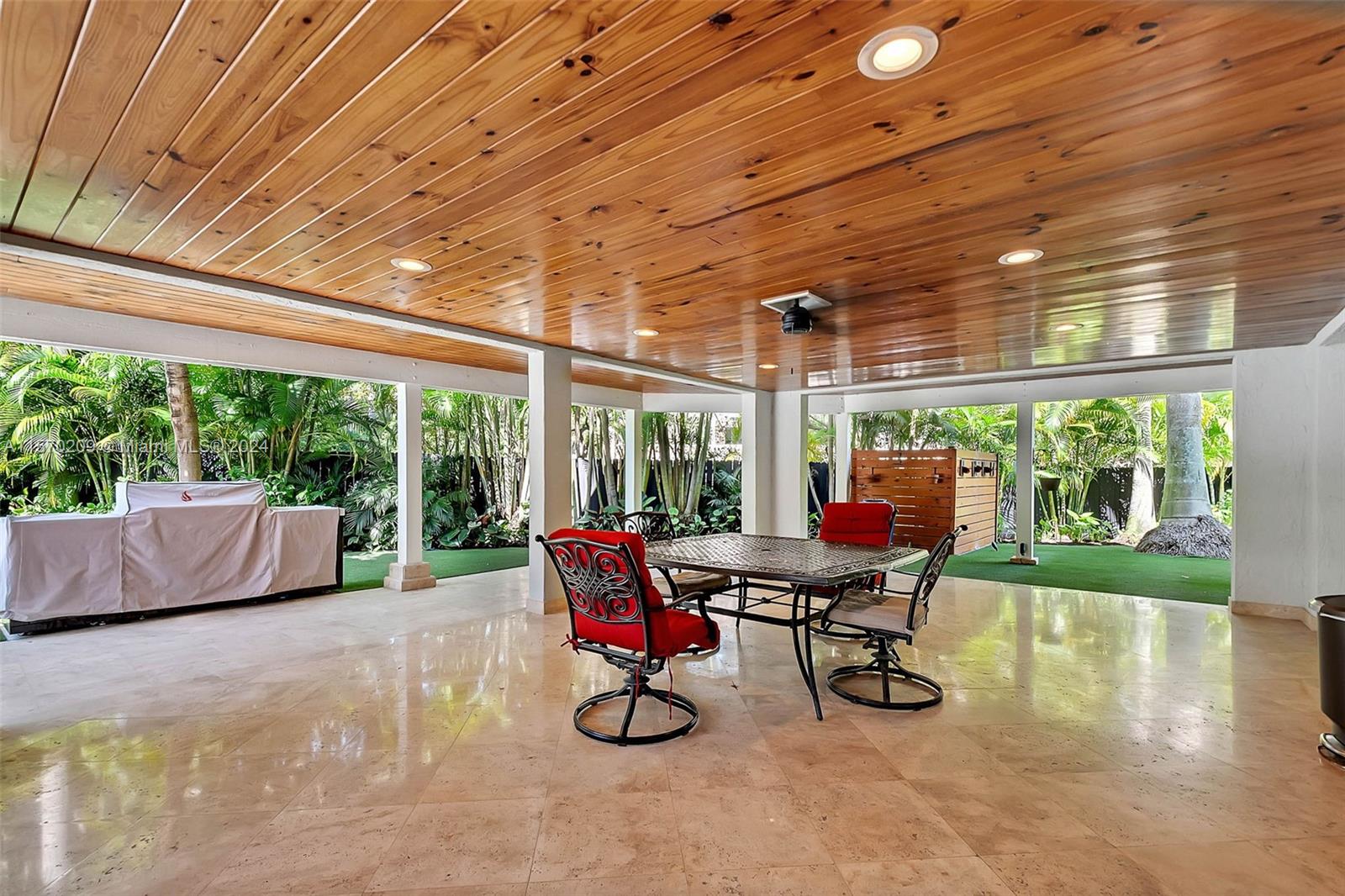 3620 Curtis Lane Miami, FL 33133 - Photo 21 of 33 a view of a room with gym equipment and large windows