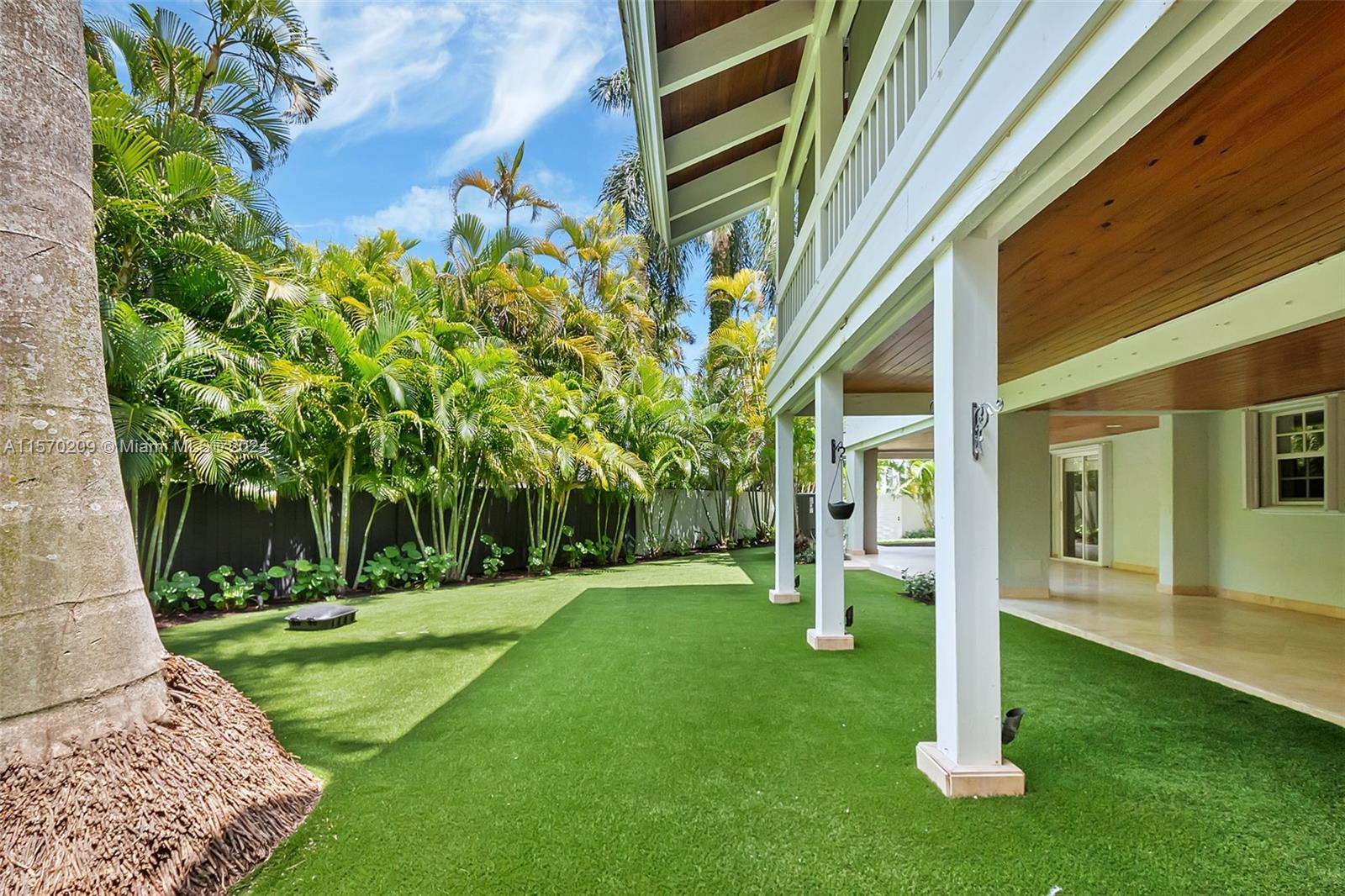 3620 Curtis Lane Miami, FL 33133 - Photo 23 of 33 a garden with trees in front of it