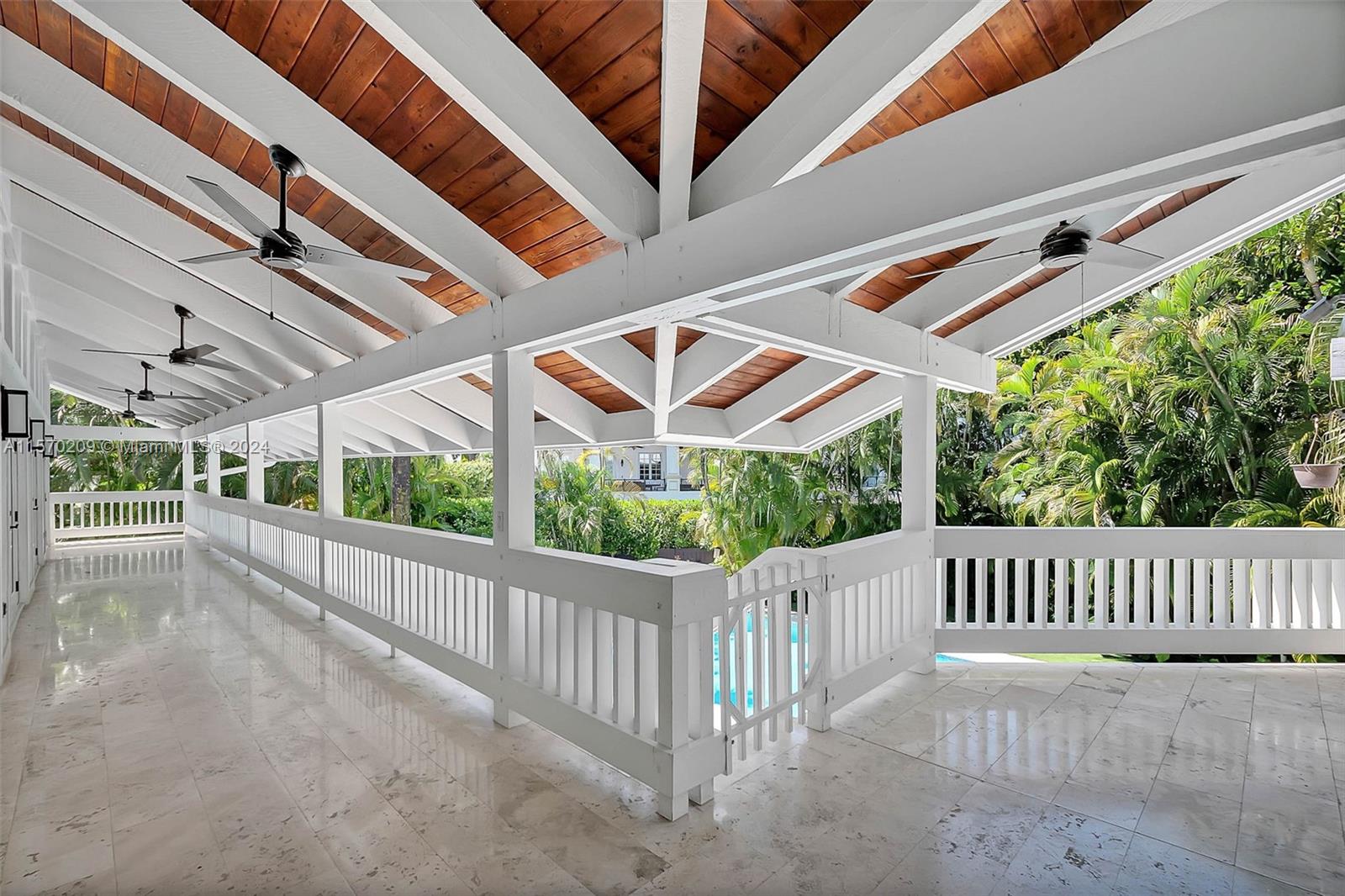 3620 Curtis Lane Miami, FL 33133 - Photo 24 of 33 a view of a porch with wooden floor