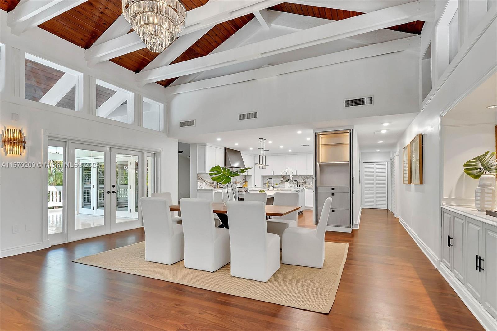 3620 Curtis Lane Miami, FL 33133 - Photo 4 of 33 a view of a living room and kitchen with stainless steel appliances