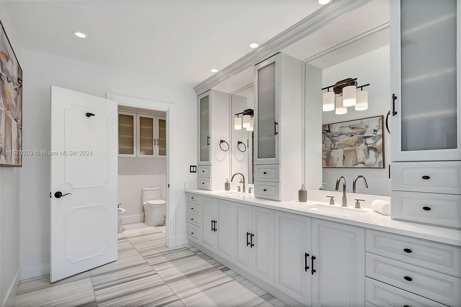 3620 Curtis Lane Miami, FL 33133 - Photo 10 of 33 a spacious bathroom with double vanity a mirror and shower