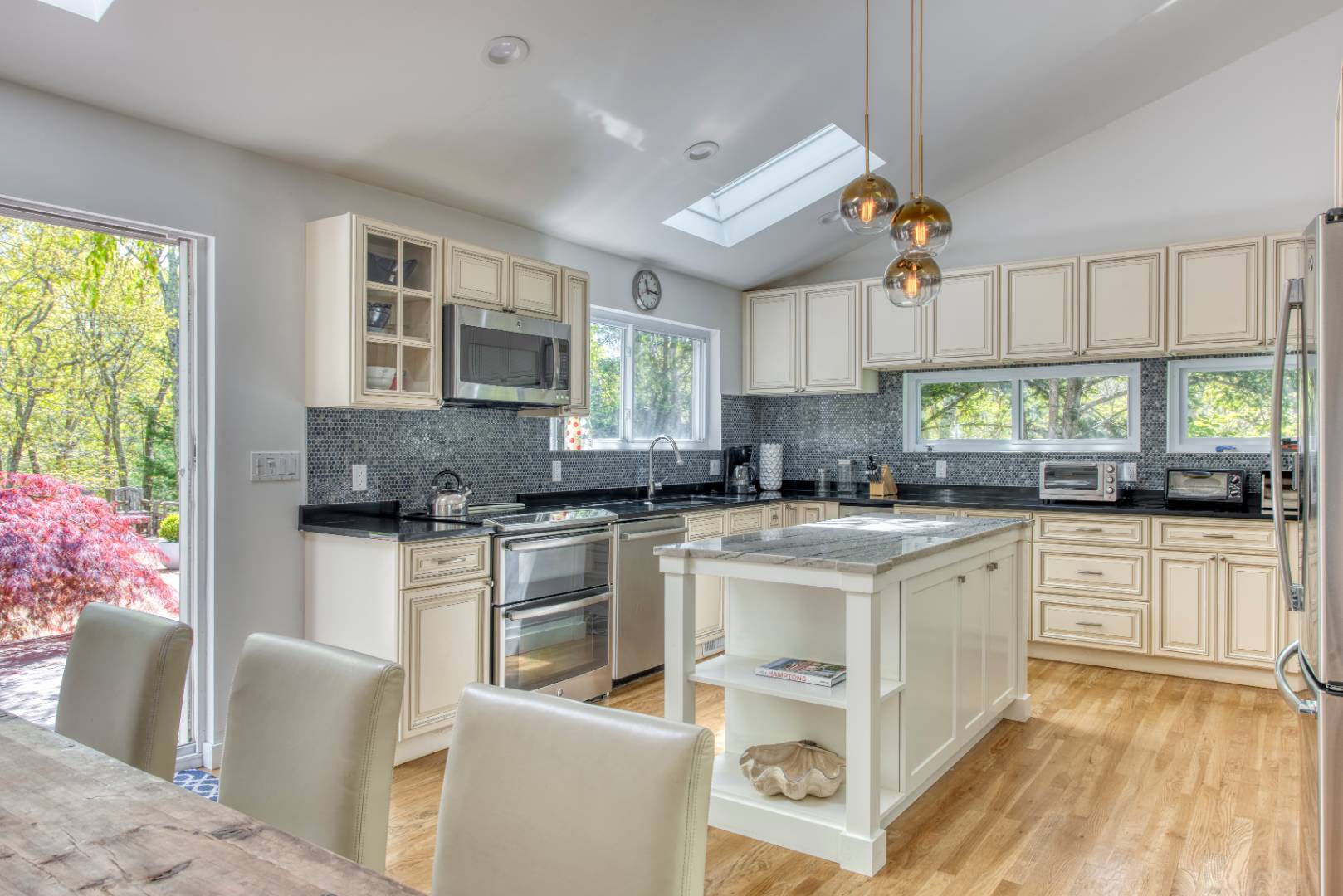 30 Wheelock Walk East Hampton, NY 11937 - Photo 4 of 15 a kitchen with cabinets a sink and a stove