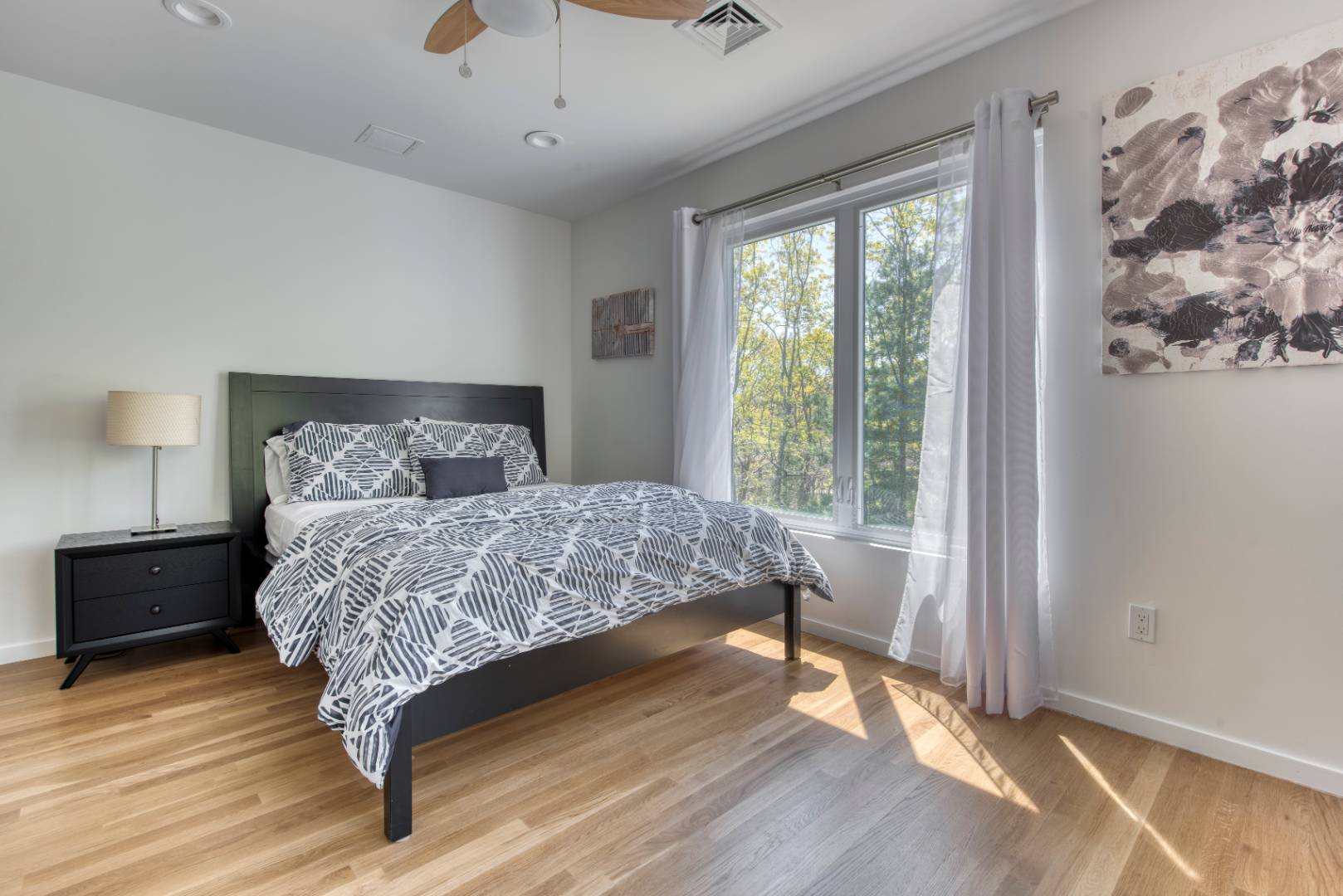 30 Wheelock Walk East Hampton, NY 11937 - Photo 8 of 15 a bedroom with a large bed and a window